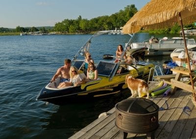 Boat Docked with People and Dog