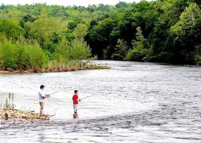 Father and Son Fish on the River